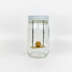 Swing | Sit ball on seat to swing | Jar Games
