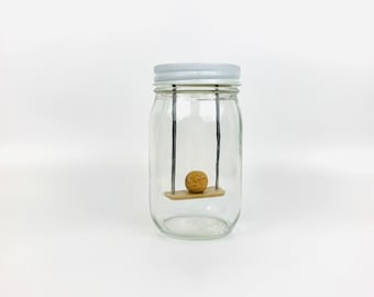 Swing | Sit ball on seat to swing | Jar Games