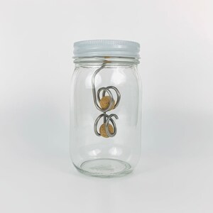 Opposing Coil | Nest one ball in each coil | Jar Game