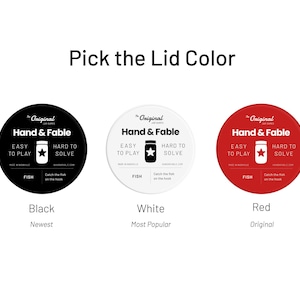 May include: Three round labels with the text "The Original Jar Games" and "Hand & Fable" in black text. The labels are black, white, and red. The text "Black", "White", and "Red" are below the labels. The text "Newest", "Most Popular", and "Original" are below the text "Black", "White", and "Red".