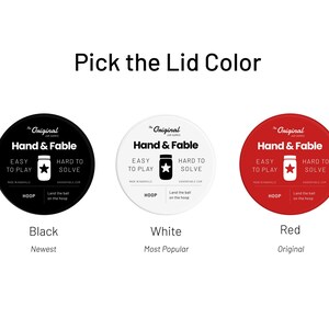 May include: Three round jar lids with the text "The Original Jar Games Hand & Fable" in black text on a white background. The lids are black, white, and red. The text "Black", "White", and "Red" is below each lid. The text "Newest", "Most Popular", and "Original" is below the color names.
