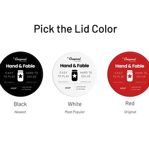 May include: Three round labels with the text "The Original Jar Games" and "Hand & Fable" in black text. The labels are black, white, and red. The text "Black", "White", and "Red" are below the labels. The text "Newest", "Most Popular", and "Original" are below the color names.