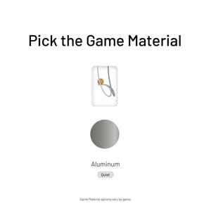 May include: A gray circle with the word "Aluminum" below it. The text "Outlet" is in a gray rectangle below the word "Aluminum". The text "Pick the Game Material" is at the top of the image. A small image of a silver game piece is above the circle.