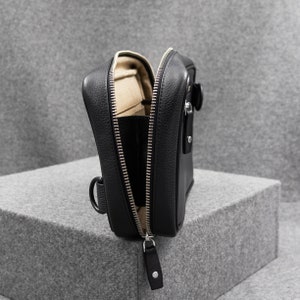 Side profile of the tech pouch. The design is slim, and just enough to carry most of your tech gear. The image shows YKK metallic zippers that ensure smooth functioning.