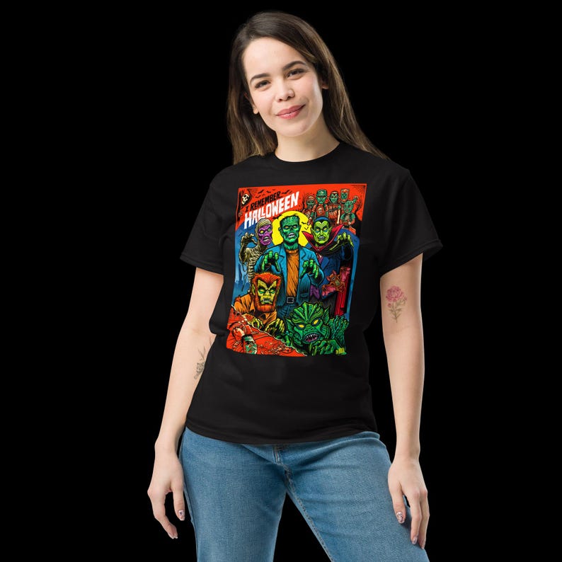 May include: Black t-shirt with a graphic of a comic book cover featuring a group of monsters and the text "CREATURE HALLOWEEN".