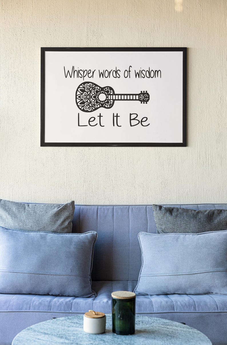 May include: A black framed print with the text "Whisper words of wisdom Let It Be" and a decorative guitar design.
