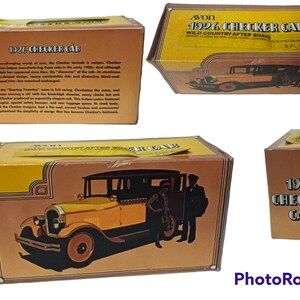 May include: A yellow and brown cardboard box featuring a vintage Checker Cab taxi on the front. The box is labelled "1926 Checker Cab" and "Wild Country After Shave".