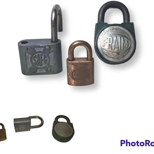 May include: Assortment of vintage padlocks in various sizes and colours, including silver, brass, and green. Some padlocks feature the words "SAFE" and "FRAIM" on the front.