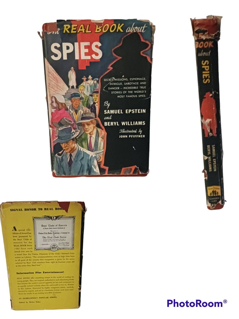 May include: A vintage paperback book titled "The Real Book About Spies" with a black and white illustration of spies on the cover. The book is part of a series called "An Increasingly Popular Series" and has a red spine with the title "The Real Book About Spies" in white text.