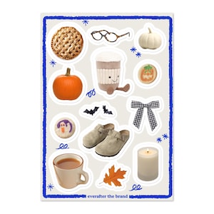 May include: A sticker sheet with various fall-themed illustrations. Includes a pie, pumpkins, eyeglasses, a coffee cup, cookies, bats, clogs, a bow, a teacup, a leaf, and a candle. The text "everafter the brand" is at the bottom.