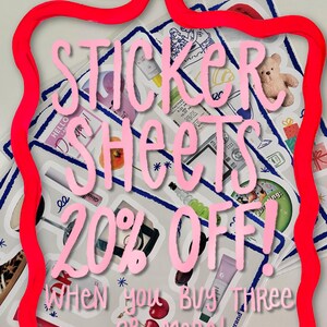 May include: A stack of sticker sheets with various designs, including a teddy bear, a glass of wine, a cherry, and a ladybug. The sticker sheets are surrounded by a red ribbon and the text "Sticker Sheets 20% Off! When you buy three or more!" is written in pink.