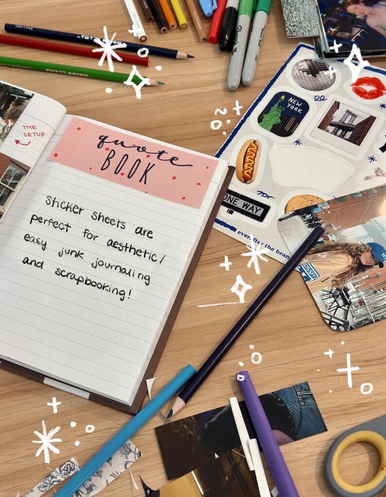 May include: A pink and white notebook with the words "quote book" written on the cover. The notebook is open to a page with the text "Sticker sheets are perfect for aesthetic/ easy junk journaling and scrapbooking!" written in black ink.