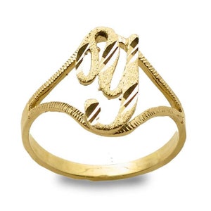May include: A gold ring with a cursive letter 'J' design. The ring is made of 10k gold and has a diamond-cut finish.