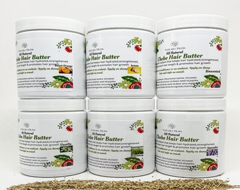 May include: Six white jars of Chebe Hair Butter, a natural hair product, with different scents: Sweet Orange, Lemon, Unscented, Vanilla, Rosemary, and Lavender. Each jar has a label with the product name, ingredients, and scent.