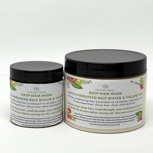 May include: Two white plastic jars with black lids containing hair masks. The larger jar is labeled "Deep Hair Mask (With Fermented Rice Water & Tallow Fat)" and the smaller jar is labeled "Deep Hair Mask Fermented Rice Water & Tallow". Both jars are labeled "All Natural" and "Najurel Bliss".