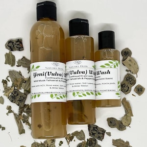 May include: Three bottles of clear liquid with white labels. The labels have the text "Yoni (Vulva) Wash" and "Mild Musk Tahaarah & Peppermint Scent". The bottles are on a white surface with dried leaves.