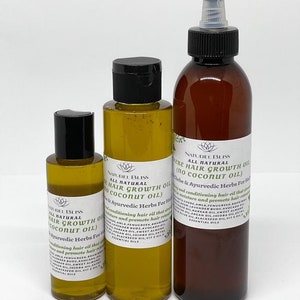 May include: Three glass bottles of hair growth oil with black caps and labels. The labels are white with black text and list the ingredients and benefits of the oil. The bottles are on a white background.
