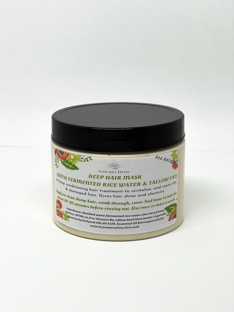 May include: A white jar with a black lid labeled "Naturel Bliss Deep Hair Mask (With Fermented Rice Water & Tallow Fat)". The label also includes a description of the product and its ingredients.