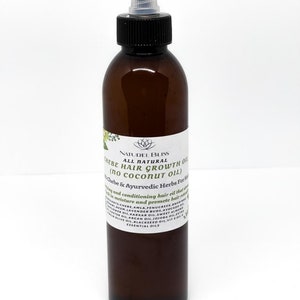 May include: A brown glass bottle with a black cap and a clear dropper. The bottle is labelled "NATUREL BLISS ALL NATURAL CHEBE HAIR GROWTH OIL (no coconut oil) Chebe & Ayurvedic Herbs For Hair".