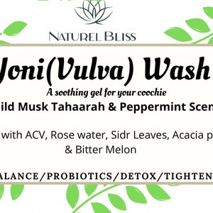 May include: A white label with green leafy vines on the top and bottom. The label reads "NATUREL BLISS Yoni(Vulva) Wash A soothing gel for your coochie Mild Musk Tahaarah & Peppermint Scent Made with ACV, Rose water, Sidr Leaves, Acacia pods, & Bitter Melon PH BALANCE/PROBIOTICS/DETOX/TIGHTENING"