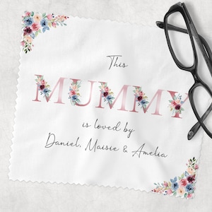 May include: White fabric cleaning cloth with pink floral designs and the text "This Mummy is loved by Daniel, Maisie & Amelia".