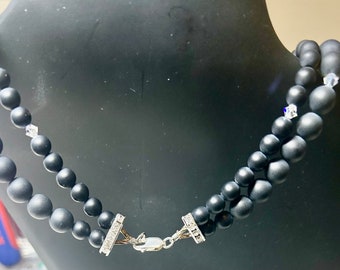 Black matte Onyx beads on 17 inch double row necklace with gorgeous 2inch metal flower with rhinestones pendant and fancy clasp.