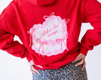 Alpha Chi Omega Sugar Rush Coquette Cake Sorority grec imprimé Gildan Sweat à capuche/Grande petite capuche assortie Sweat/Cadeau université