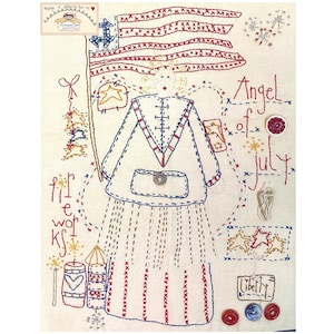 May include: Embroidered artwork featuring an angel with a red, white, and blue dress holding a flag. The text "Angel of July" is stitched above the angel, and "for fireworks" is stitched below. The artwork is on a cream-colored fabric.