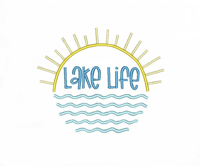 May include: An embroidery design featuring the text Lake Life in blue, positioned between a yellow sun arch with radiating rays above and light blue wavy lines representing water below, all set against a plain white background.