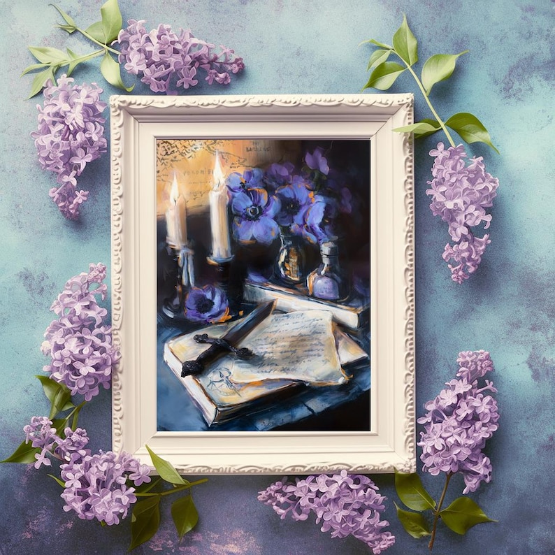 May include: A framed painting with a dark, moody aesthetic. The artwork depicts candles, flowers, a dagger, and a book. Lilac flowers and green leaves surround the white frame, set against a blue background.