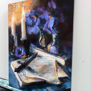 May include: An oil painting depicts a still life with a dark, moody aesthetic. It features lit candles, purple flowers in glass bottles, a book with a dagger, and handwritten notes. The color palette includes deep blues, purples, and warm yellows.