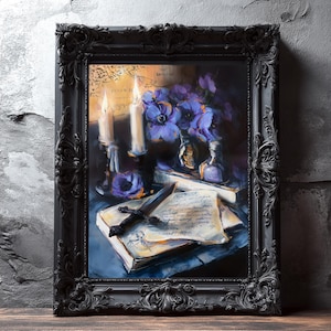 May include: A framed still life painting featuring candles, purple flowers, and antique books. The artwork is set in a dark, ornate black frame. The painting has a vintage aesthetic with a moody, atmospheric quality.