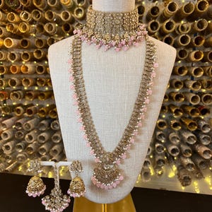 Indian bridal jewelry / pink bridal / jhumka / choker set / tikka / gold and pink bridal jewelry
