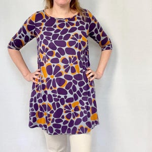 Marimekko dress ade from soft stretch fabric, this dress is perfect for casual outings or layering. The 3/4 sleeves and timeless design make it a versatile piece for any wardrobe