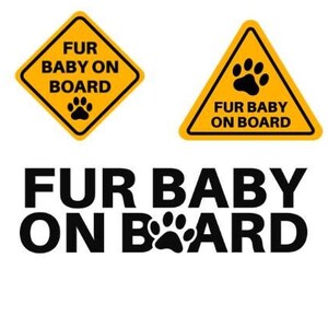 May include: Three yellow warning signs with black text and a paw print. The signs read "Fur Baby On Board".