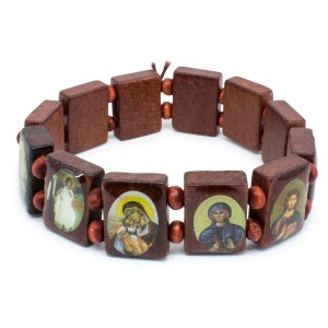 May include: A wooden bracelet featuring rectangular beads with religious icons. The beads are a dark brown color, connected by smaller, round, reddish-brown beads. The icons depict various religious figures and scenes.