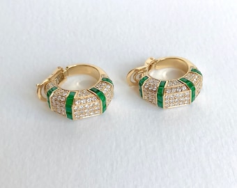 PIAGET Clip-on earrings in 18 kt yellow gold with diamonds and emeralds.
