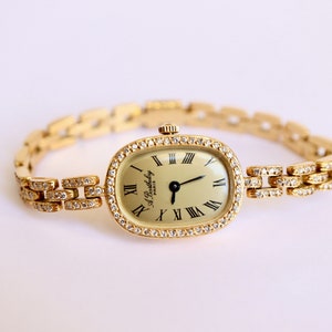 BARTHELAY Women&#39;s wristwatch in 18 carat GOLD and diamonds from Alexis Barthelay.