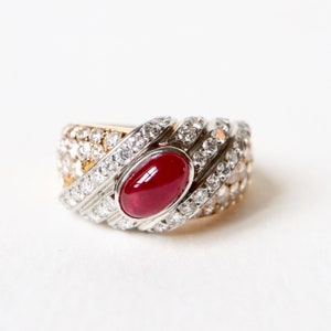 TABBAH Ring in 18K yellow gold and platinum set with a cabochon ruby and diamonds