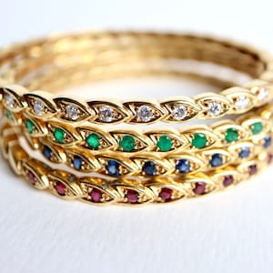 Chaumet 18K guldarmband med diamanter, rubiner, safirer och smaragder