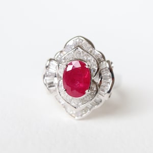 1.98 carat ruby and diamond ring in 18 carat white gold in skirted shape.