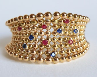 BOUCHERON Vintage bracelet with 18-carat yellow gold beads and ruby sapphires 1960s