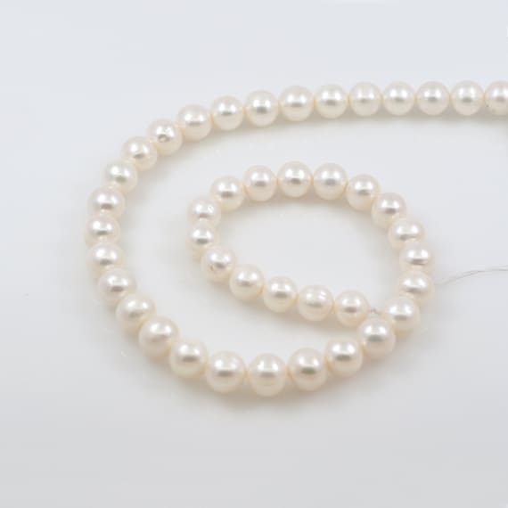Gorgeous Oval Near Round White Freshwater Pearl Beads with Small