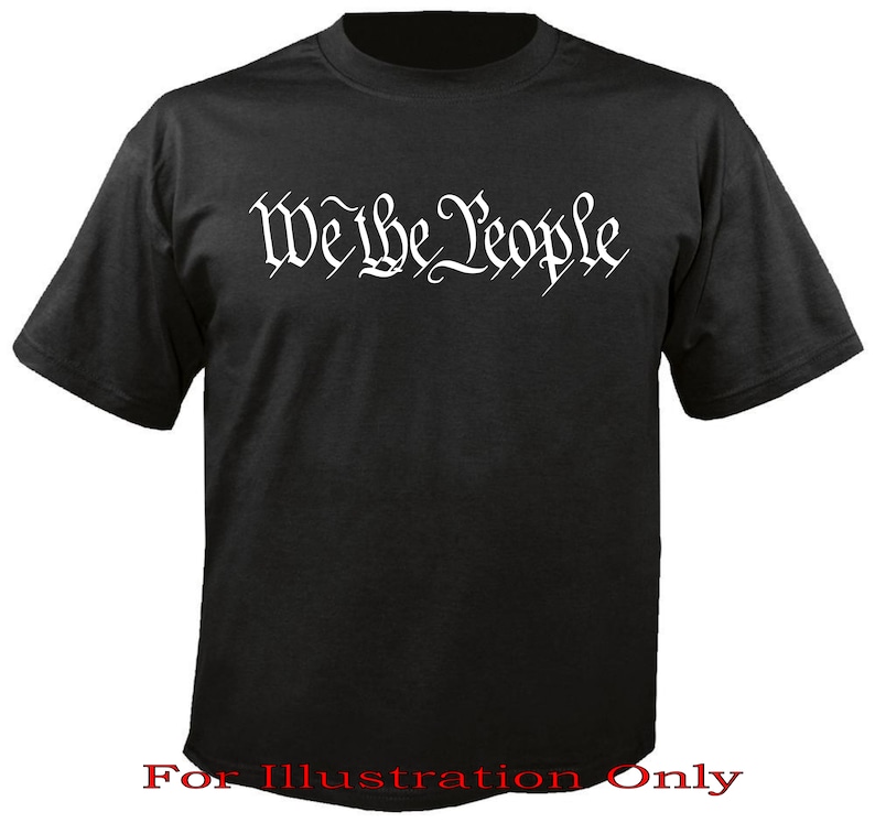 May include: Black t-shirt with the words "We the People" printed in white on the front. The text is in a stylised font.