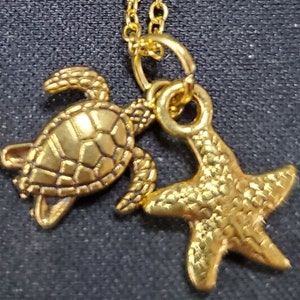 Gold plated chain with gold turtle and sea star charms