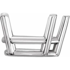 May include: A shiny, silver-colored jewelry setting with a four-prong design. The setting is made of polished metal and is designed to hold a gemstone. The prongs are evenly spaced and angled inward.
