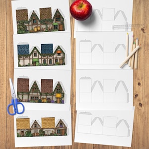 Overhead view of several printable sheets for paper cottages. On the left are four sheets with colorful, textured cottage designs. On the right are four corresponding blank template sheets, along with a ruler, pencils, and a red apple, all on a light wooden background. Blue scissors are visible in the lower left.