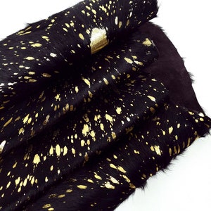 Pelle bovina nera e oro lavata con acido