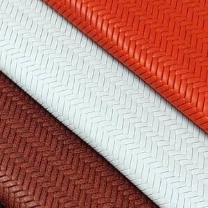 May include: Five different colors of fabric with a herringbone pattern. The colors are turquoise, black, brown, white, and orange.