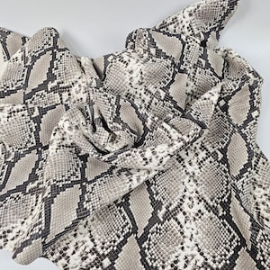 White and Black Laminated Snake Pattern Relief Leather